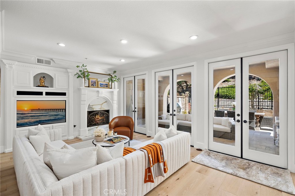 28 Tuscany Ladera Ranch, CA 92694 - Photo 11 of 47 a living room with furniture a fireplace and a flat screen tv