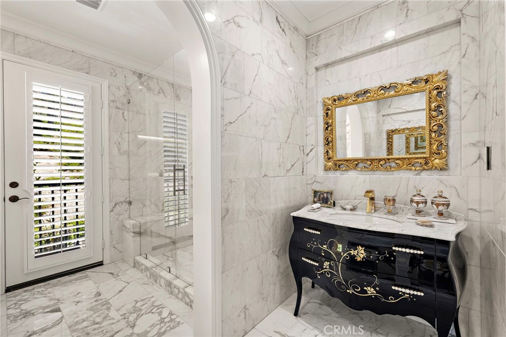 28 Tuscany Ladera Ranch, CA 92694 - Photo 24 of 47 a bathroom with a sink a vanity and a mirror