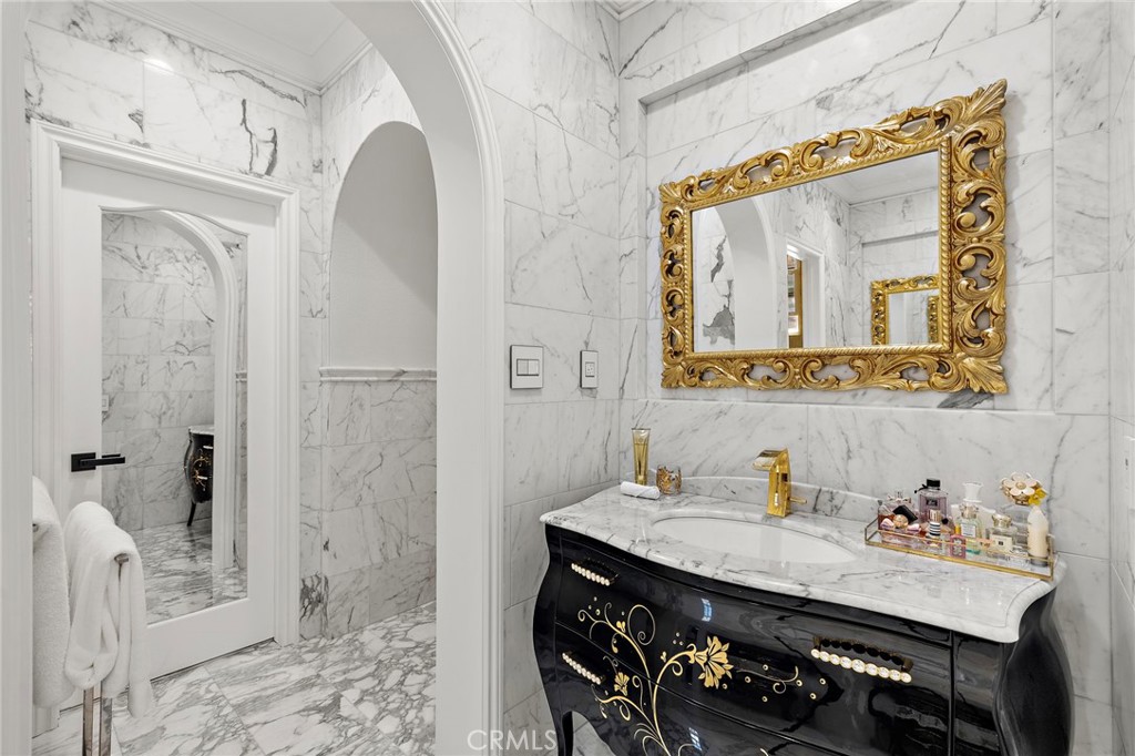 28 Tuscany Ladera Ranch, CA 92694 - Photo 28 of 47 a bathroom with a sink a mirror and a shower