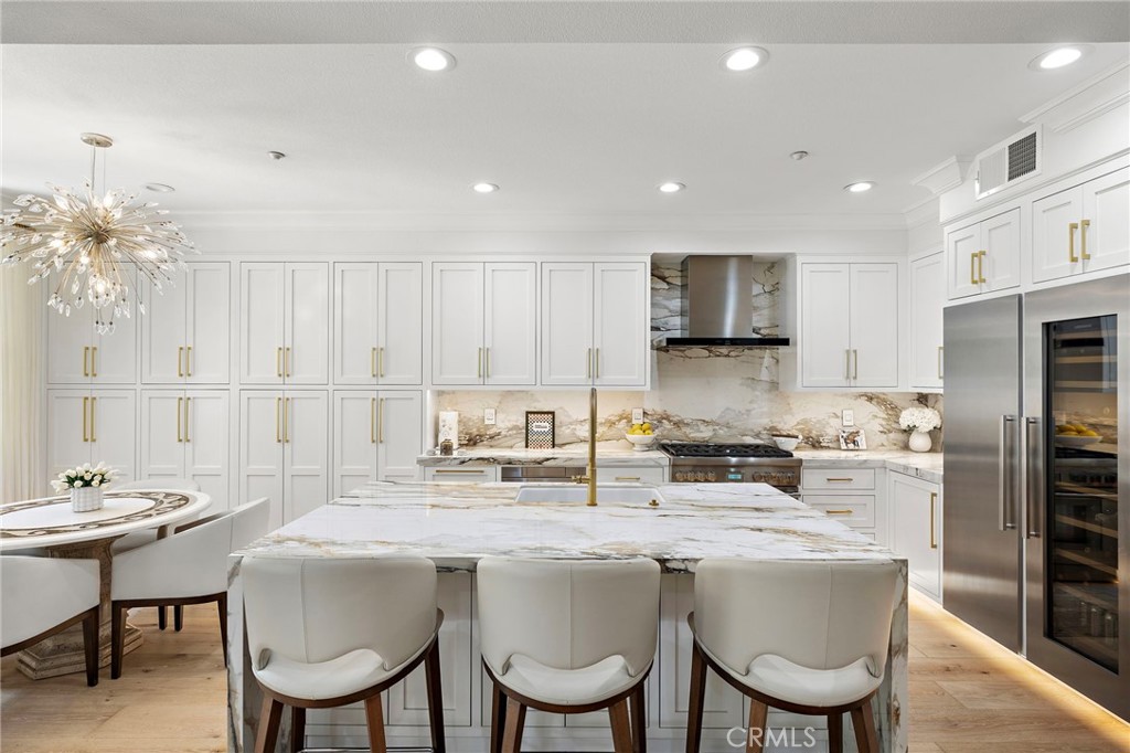 28 Tuscany Ladera Ranch, CA 92694 - Photo 3 of 47 a kitchen with granite countertop a sink stove and refrigerator