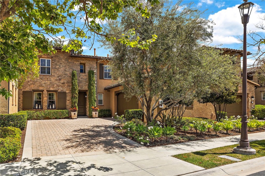 28 Tuscany Ladera Ranch, CA 92694 - Photo 40 of 47 a front view of a house with a tree