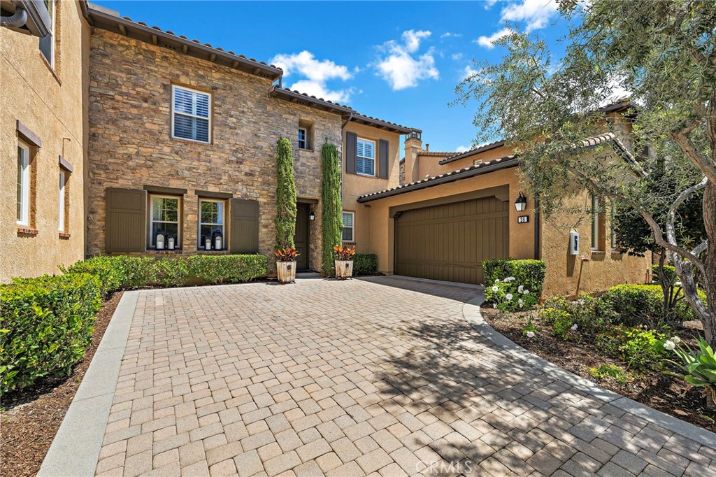 28 Tuscany Ladera Ranch, CA 92694 - Photo 41 of 47 a front view of a house with a yard and a garage