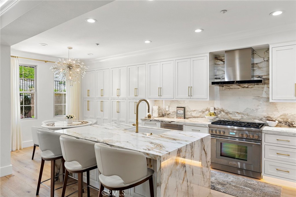 28 Tuscany Ladera Ranch, CA 92694 - Photo 6 of 47 a kitchen with granite countertop a sink stove and refrigerator