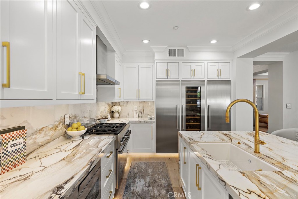 28 Tuscany Ladera Ranch, CA 92694 - Photo 8 of 47 a kitchen with stainless steel appliances granite countertop a sink stove and refrigerator