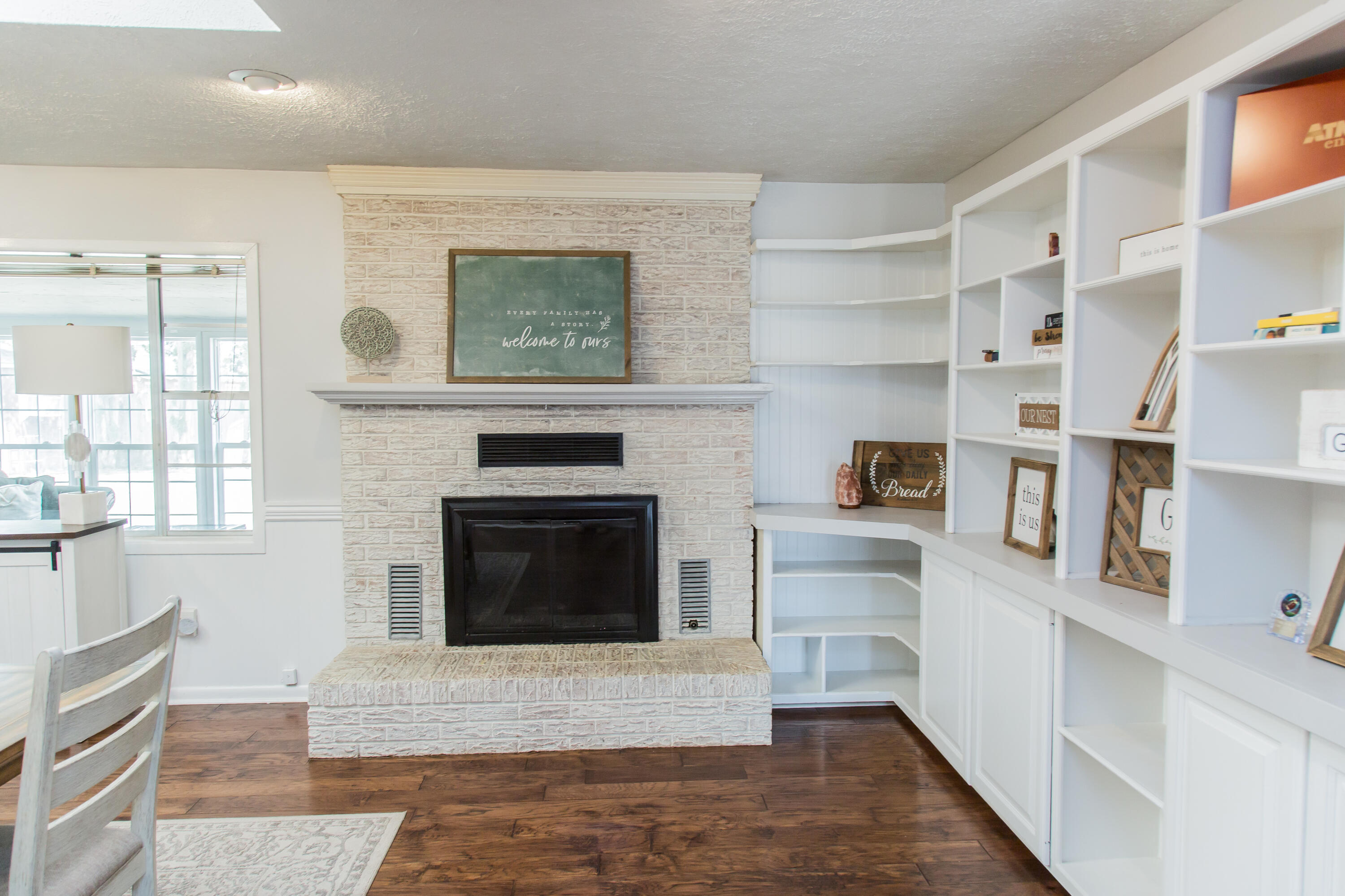 1106 Amarillo Plainview, TX 79072 - Photo 12 of 61 a living room with stainless steel appliances wooden floor and a fireplace