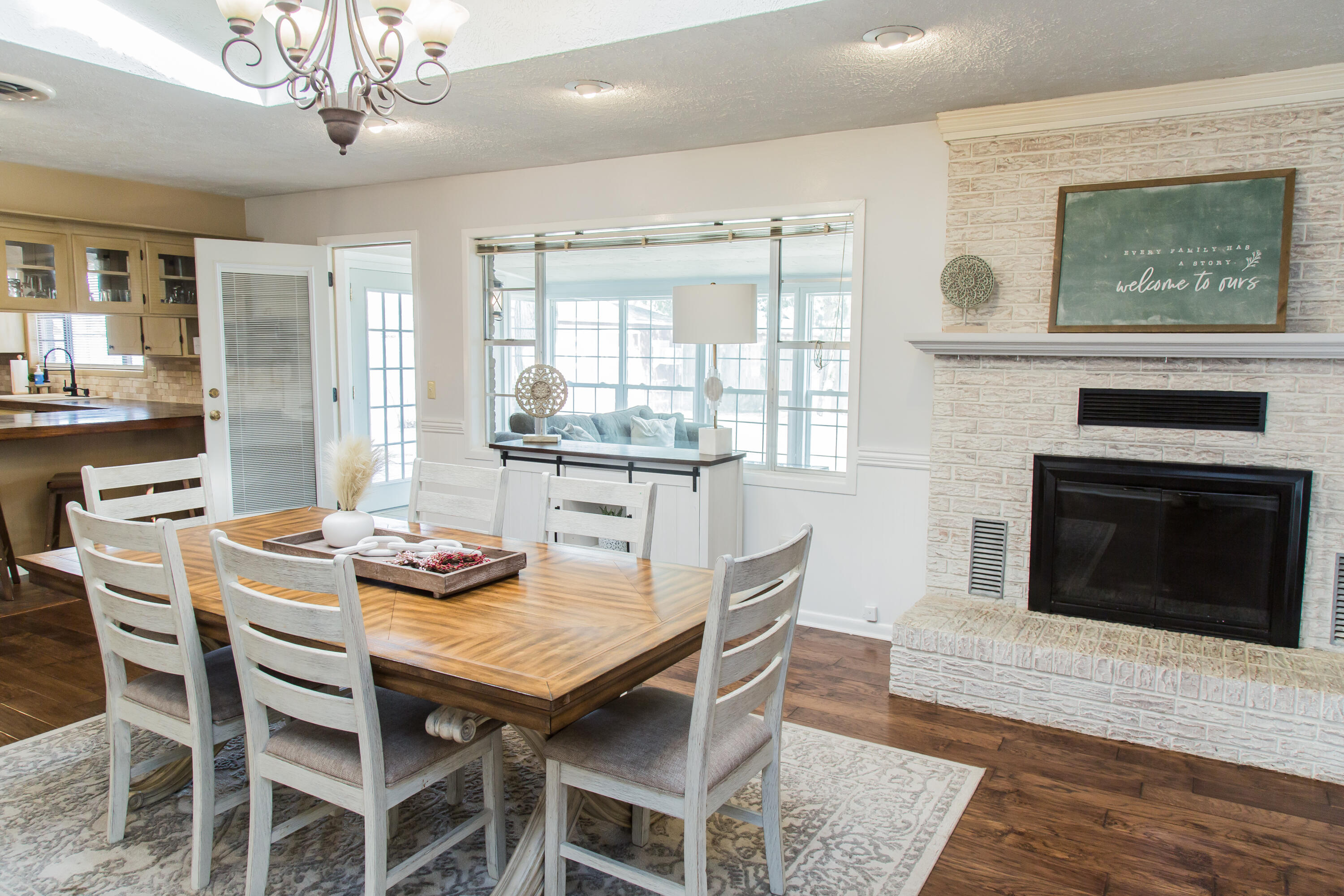 1106 Amarillo Plainview, TX 79072 - Photo 15 of 61 a dining room with furniture a fireplace and wooden floor