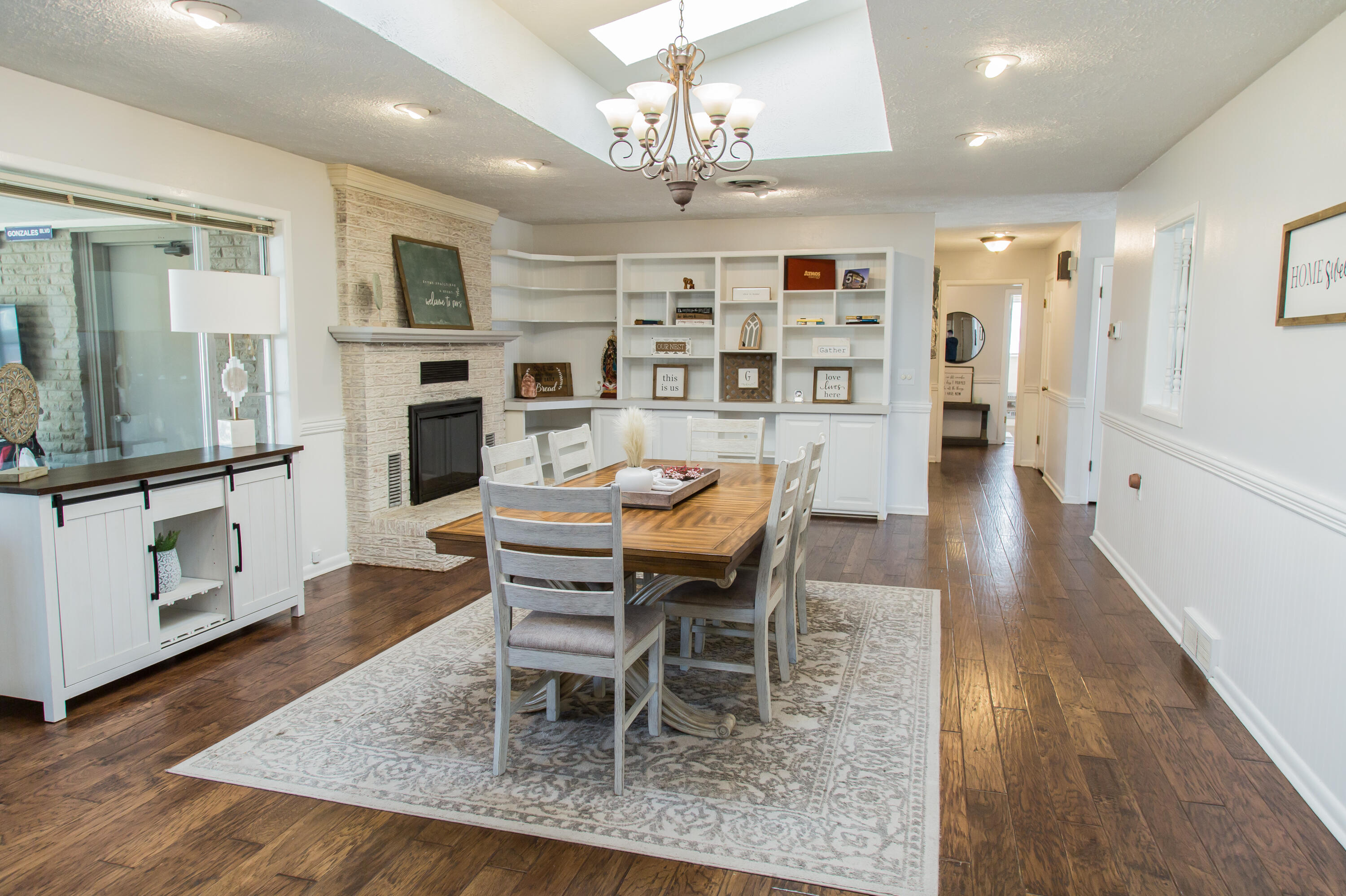 1106 Amarillo Plainview, TX 79072 - Photo 17 of 61 a dining room with furniture a kitchen and chandelier