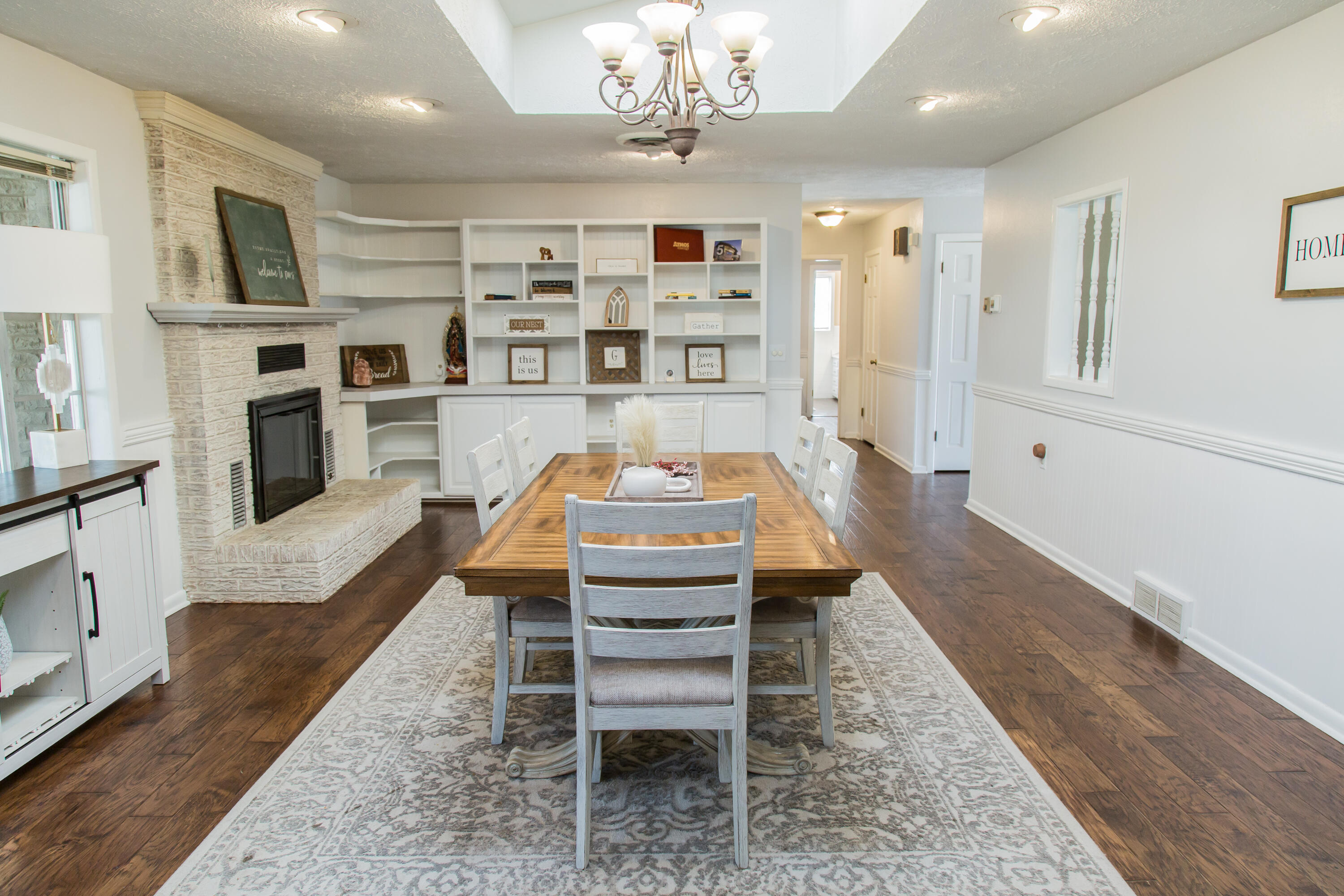1106 Amarillo Plainview, TX 79072 - Photo 18 of 61 a living room with furniture a rug and a chandelier