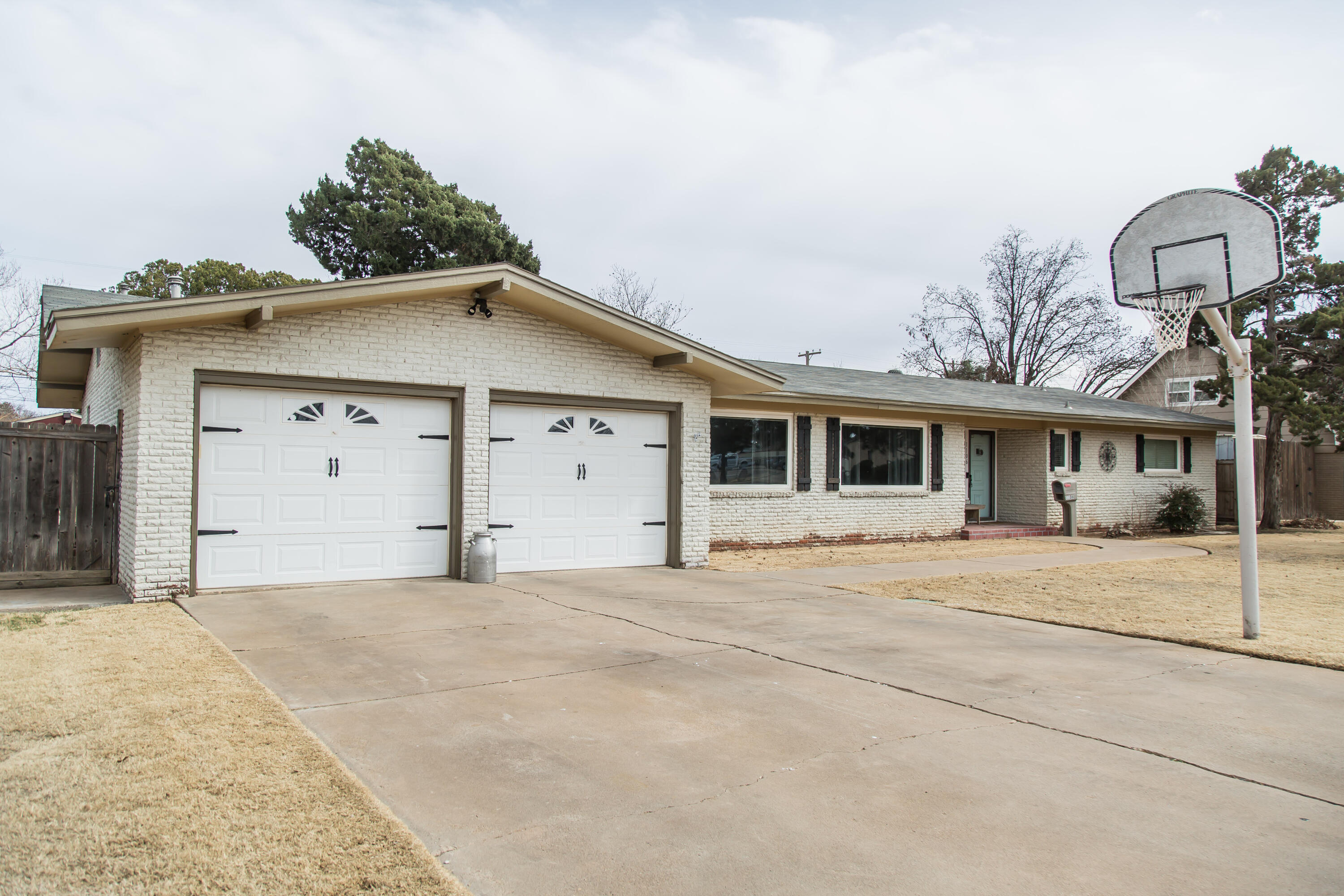 1106 Amarillo Plainview, TX 79072 - Photo 2 of 61 a front view of a house with a garage
