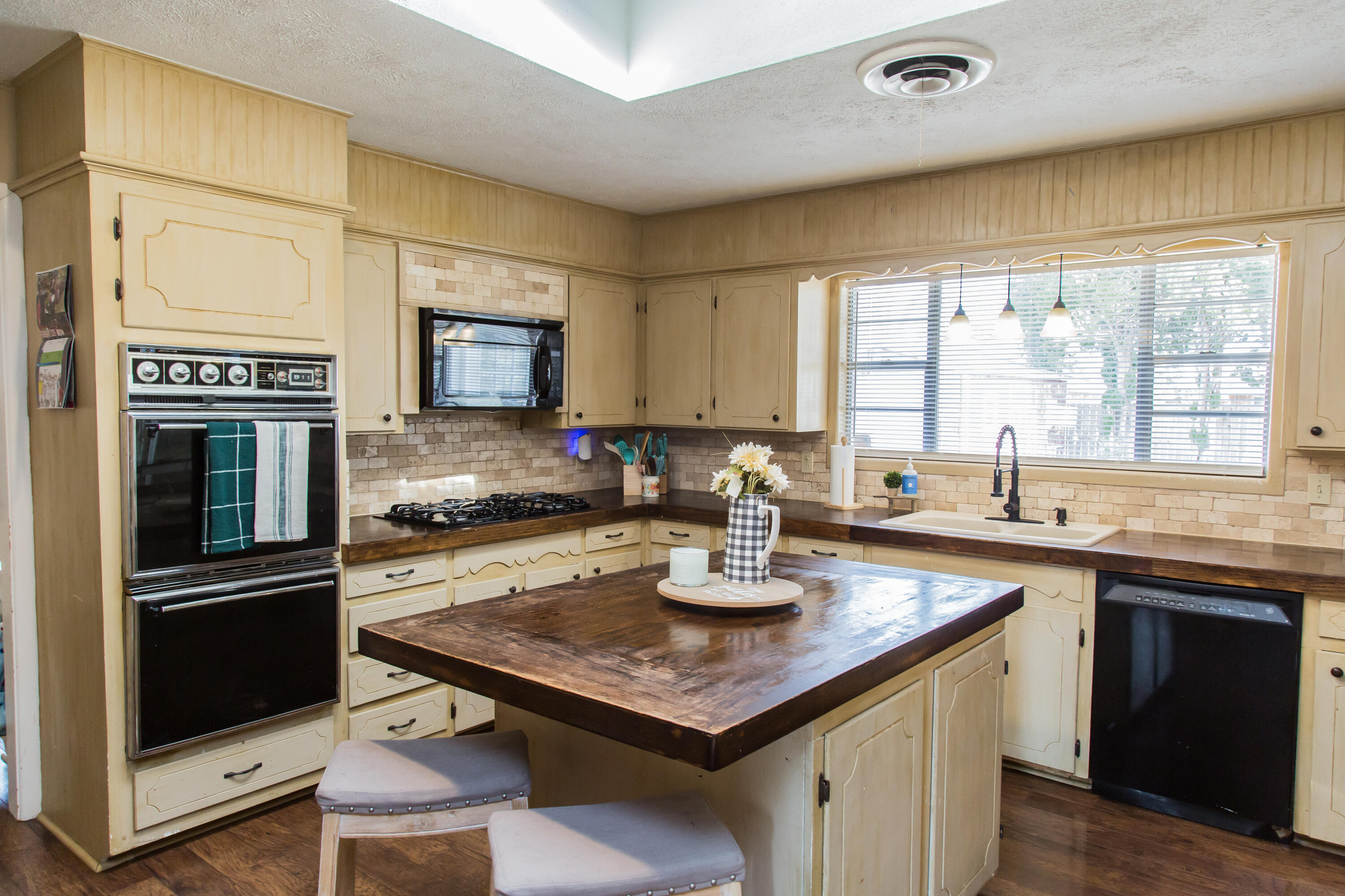 1106 Amarillo Plainview, TX 79072 - Photo 21 of 61 a kitchen with a sink stove top oven and microwave