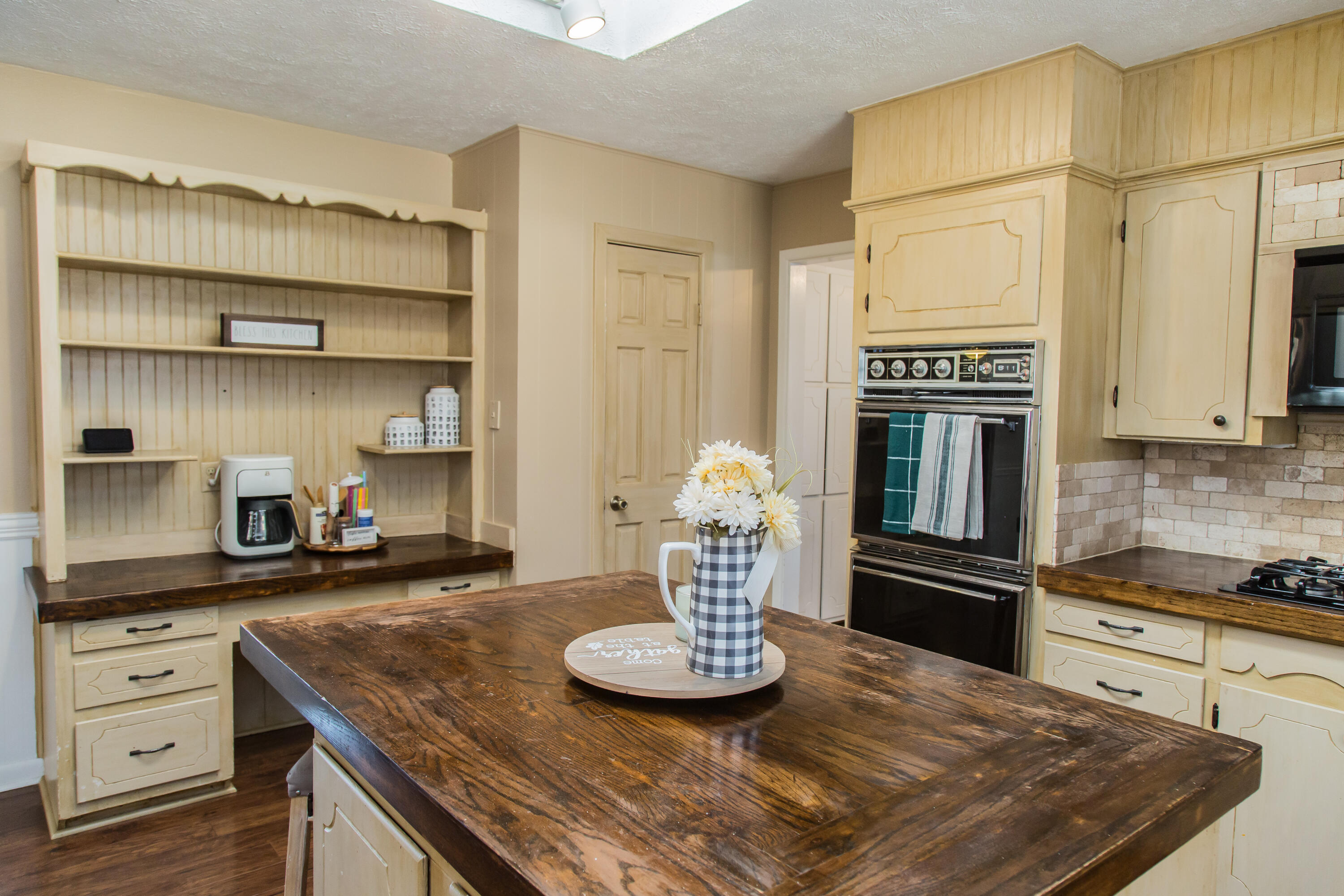1106 Amarillo Plainview, TX 79072 - Photo 23 of 61 a kitchen with kitchen island granite countertop a sink cabinets and stainless steel appliances