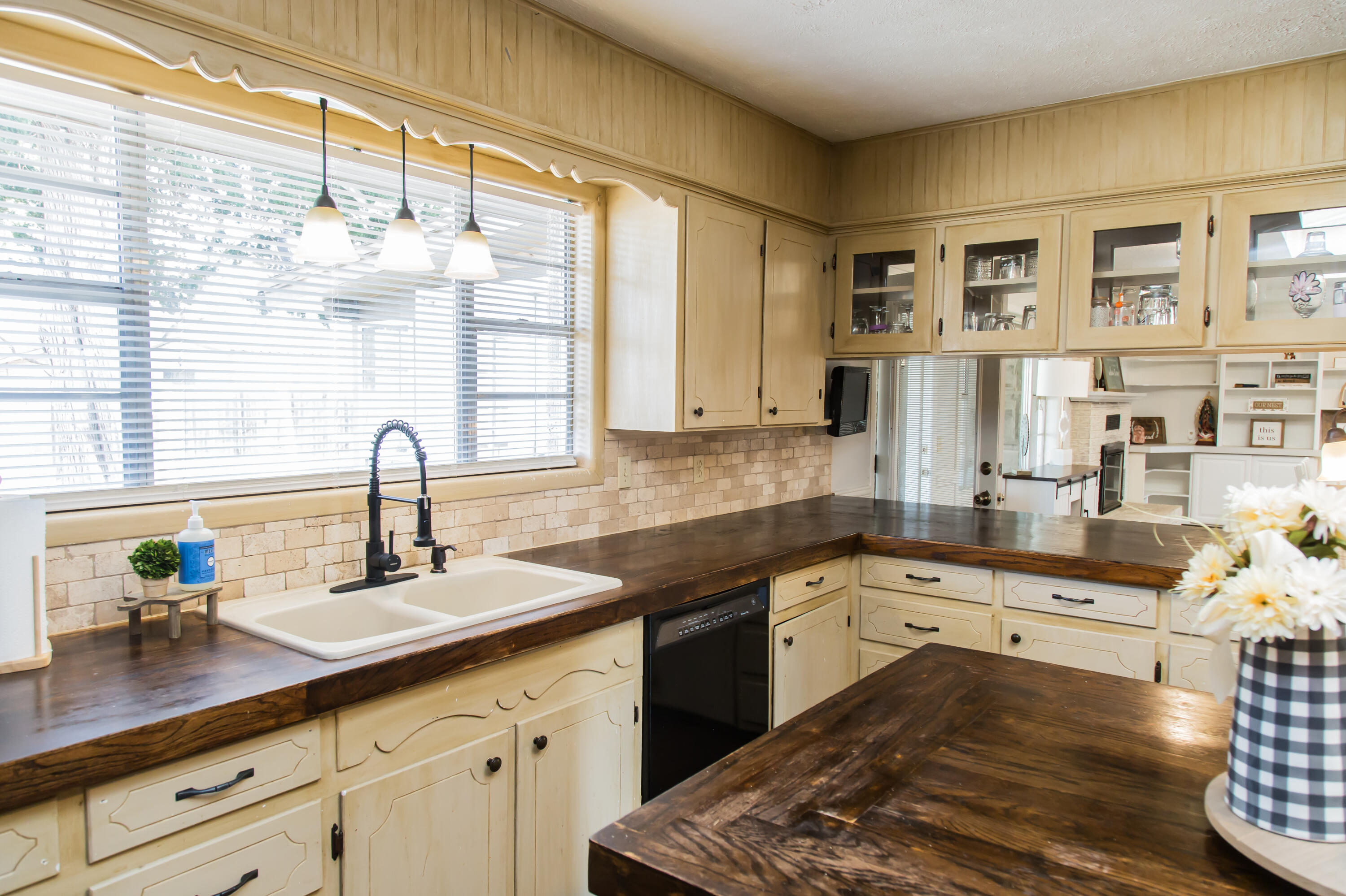 1106 Amarillo Plainview, TX 79072 - Photo 24 of 61 a kitchen with granite countertop a sink and white cabinets
