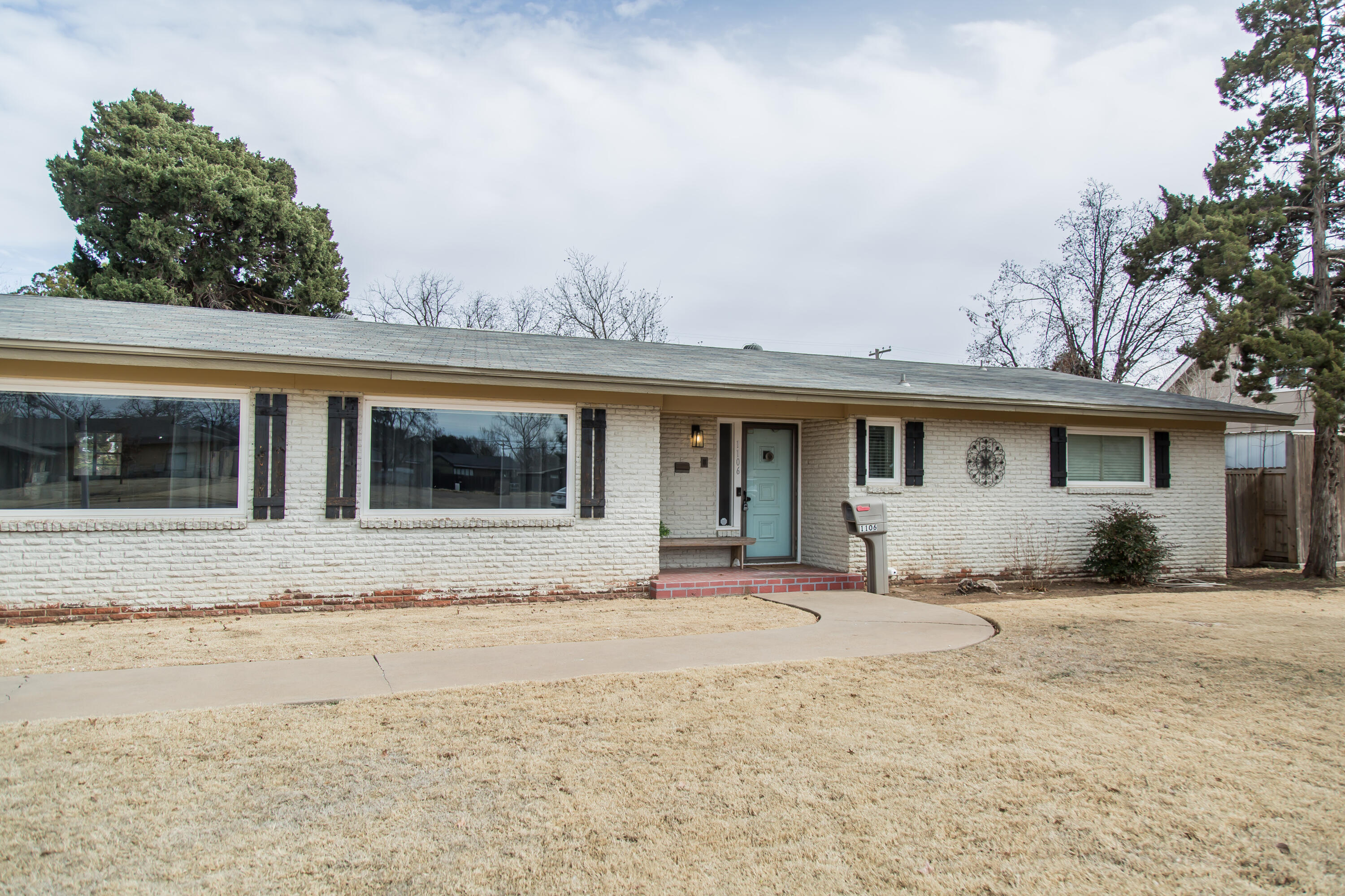 1106 Amarillo Plainview, TX 79072 - Photo 3 of 61 a front view of a house with a yard