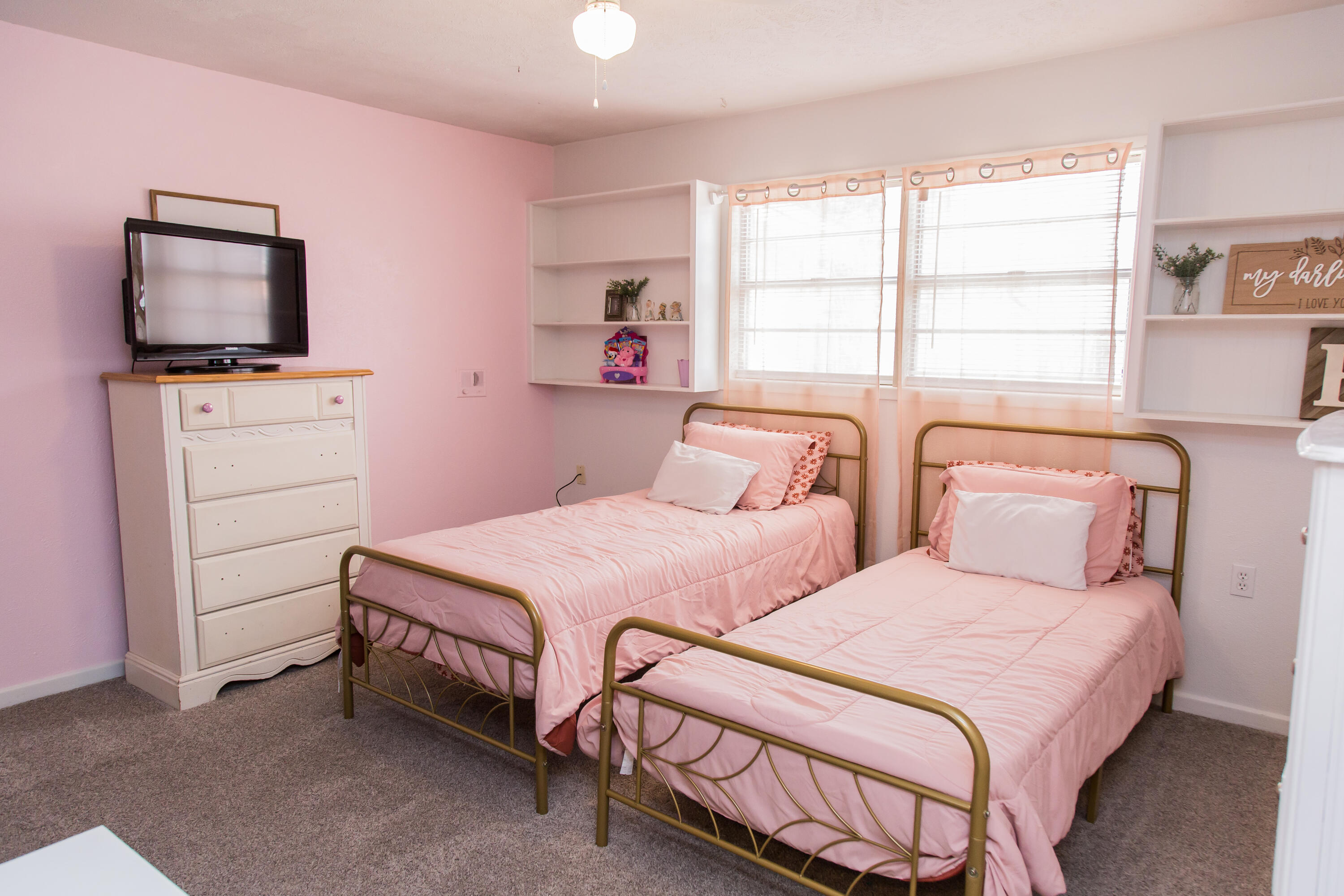 1106 Amarillo Plainview, TX 79072 - Photo 36 of 61 a bedroom with two beds and a flat screen tv