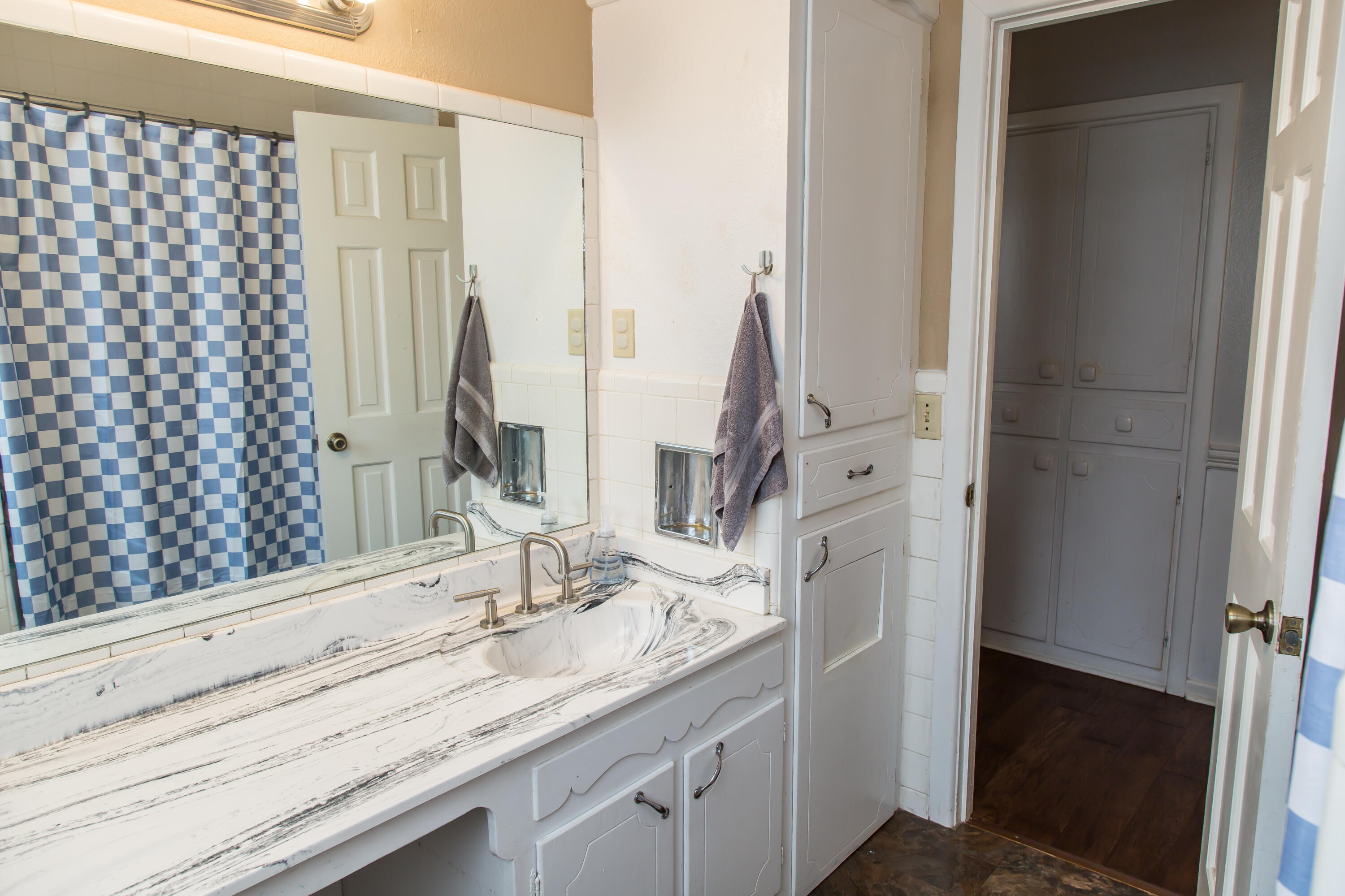 1106 Amarillo Plainview, TX 79072 - Photo 44 of 61 a bathroom with a double vanity sink and a mirror