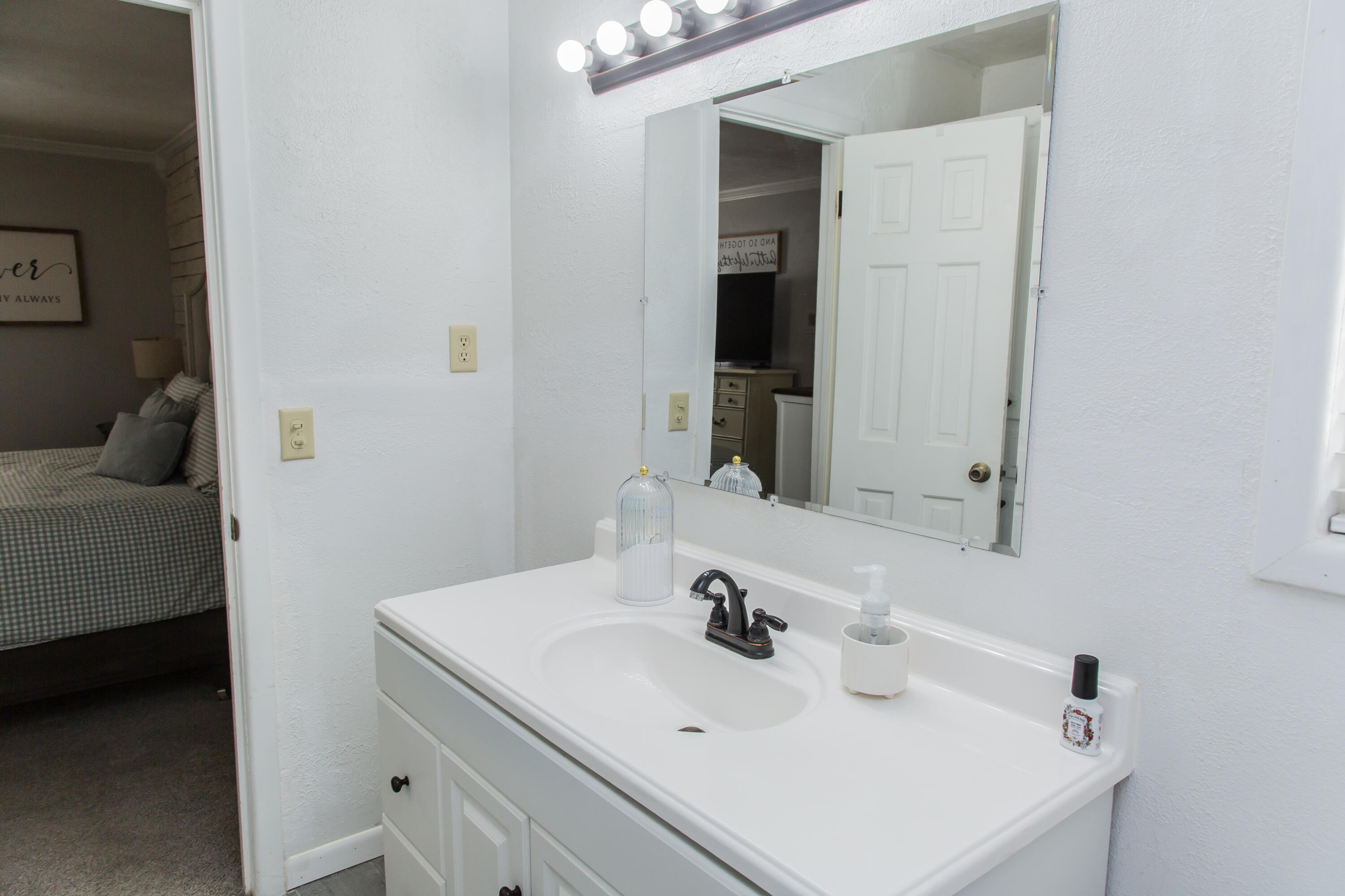 1106 Amarillo Plainview, TX 79072 - Photo 51 of 61 a bathroom with a sink and a mirror