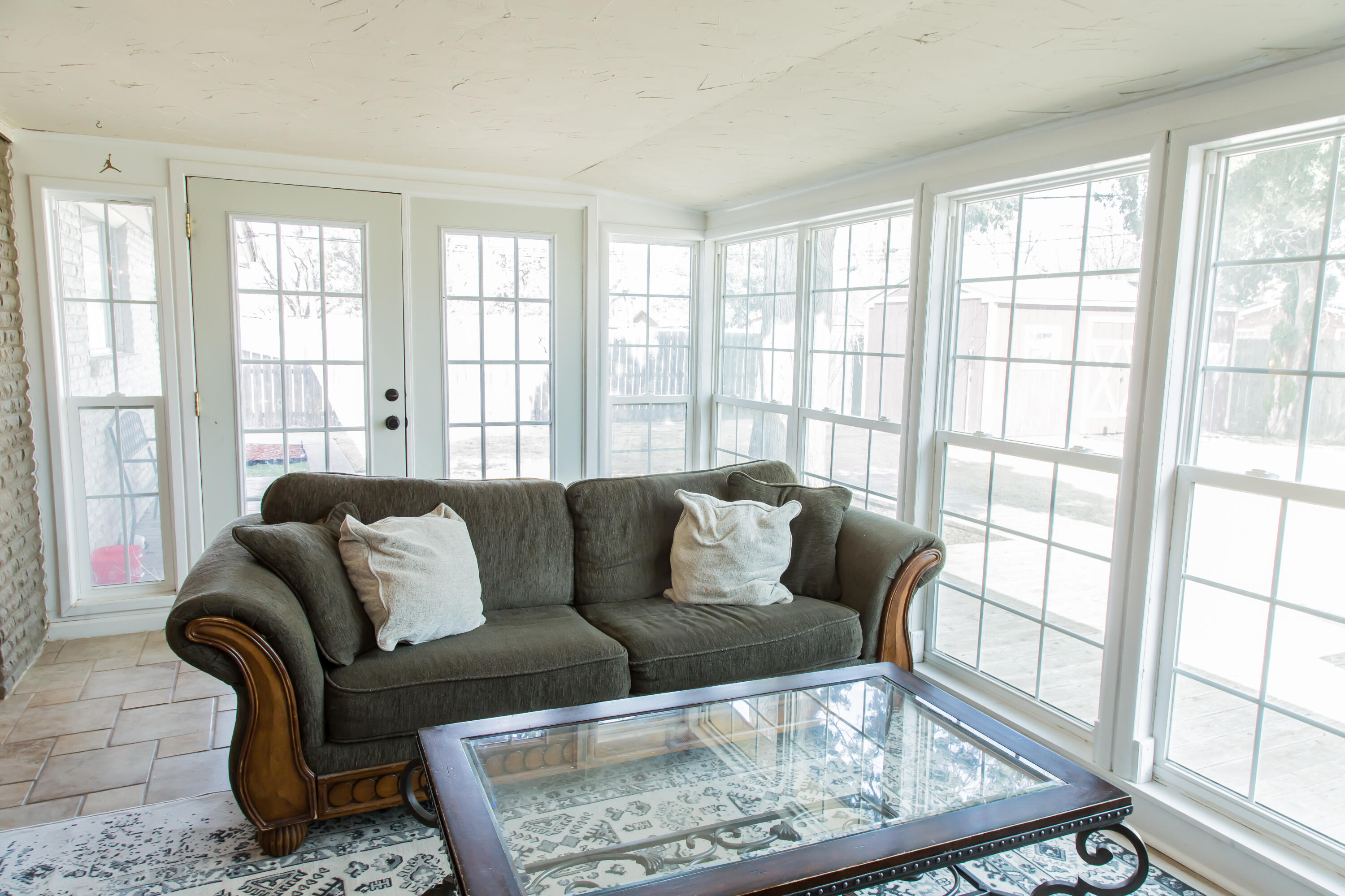 1106 Amarillo Plainview, TX 79072 - Photo 55 of 61 a living room with furniture and a floor to ceiling window