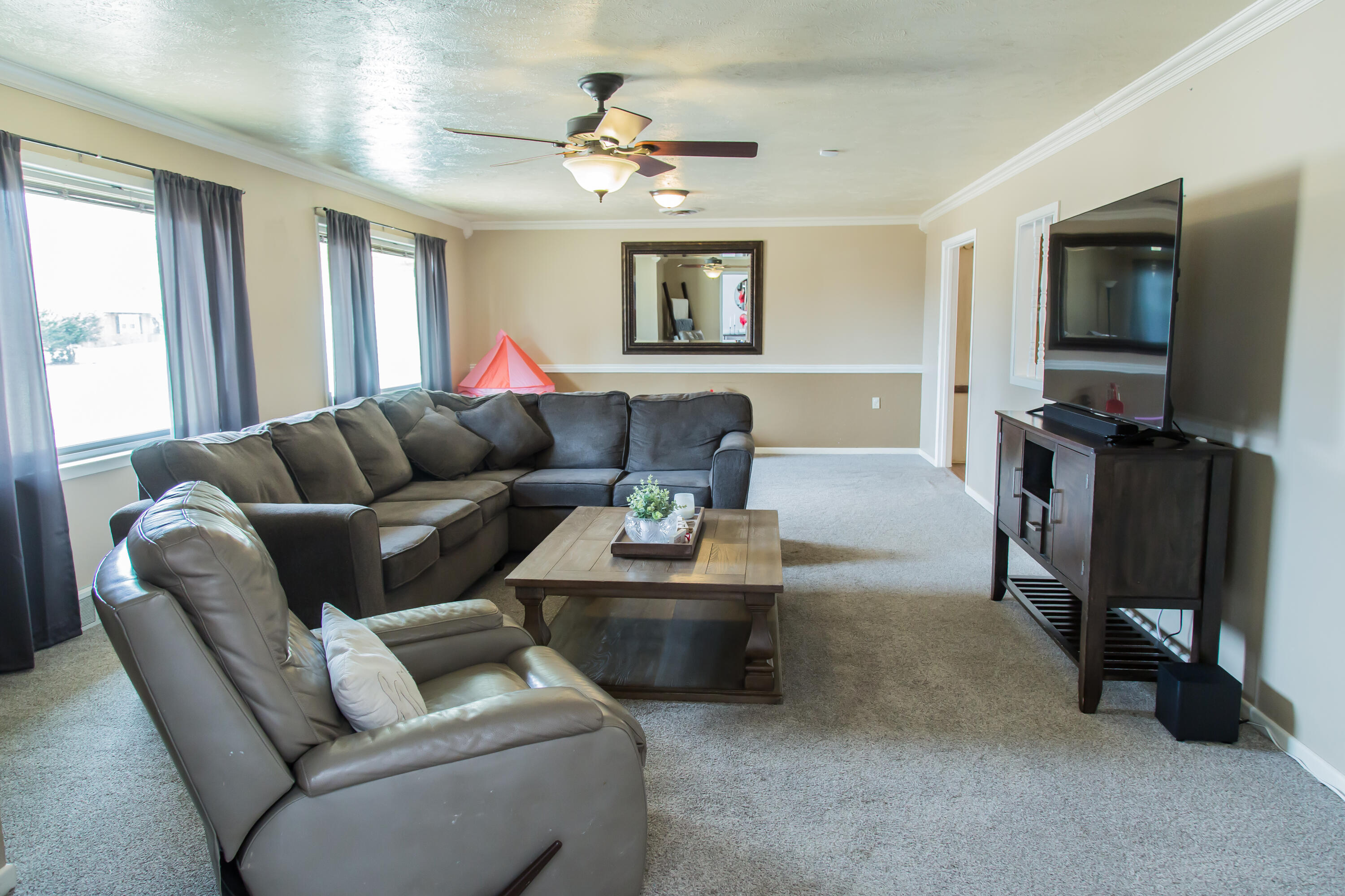 1106 Amarillo Plainview, TX 79072 - Photo 7 of 61 a living room with furniture and a flat screen tv