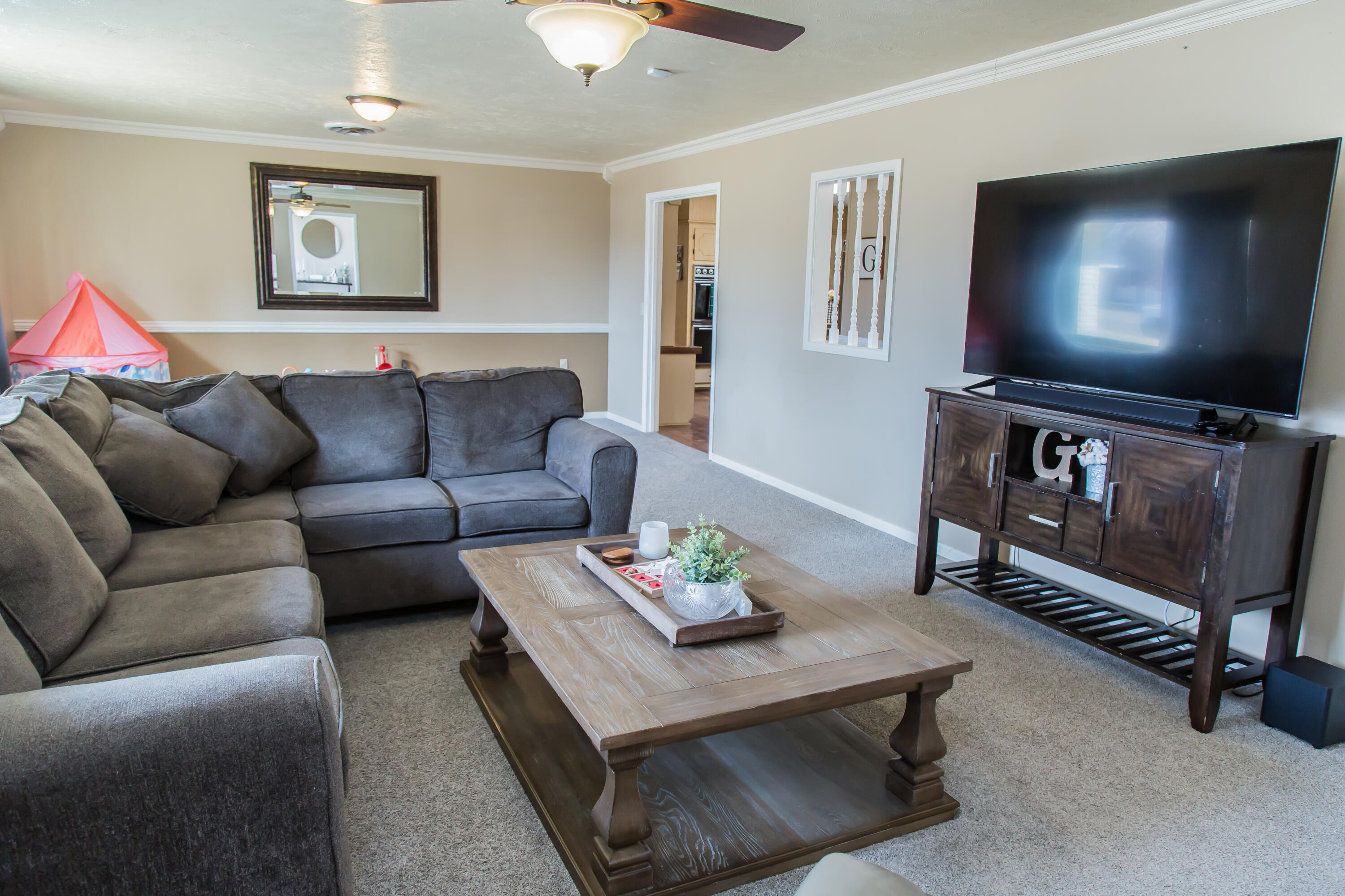 1106 Amarillo Plainview, TX 79072 - Photo 8 of 61 a living room with furniture and a flat screen tv