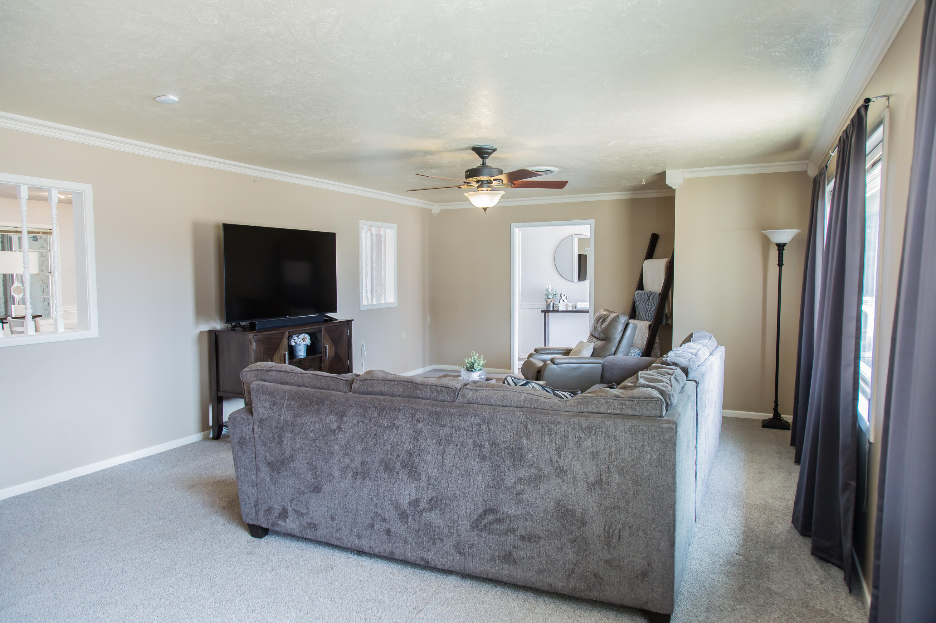 1106 Amarillo Plainview, TX 79072 - Photo 10 of 61 a living room with furniture and a flat screen tv