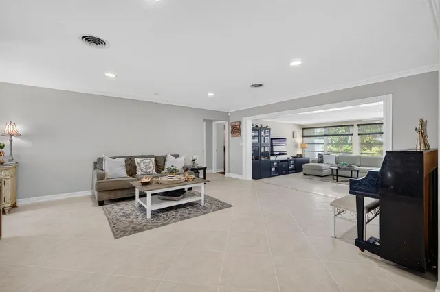 a view of a dining room with furniture wooden floor and chandelier