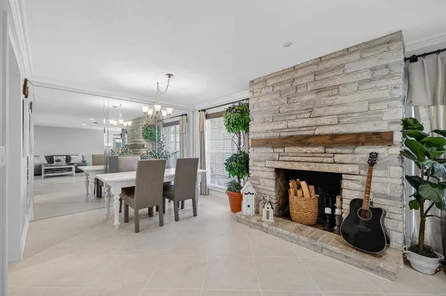 a kitchen with granite countertop a refrigerator stove and microwave