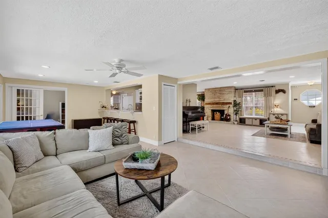 a kitchen with stainless steel appliances a sink a stove and a microwave