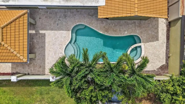 a living room with furniture a window and a chandelier