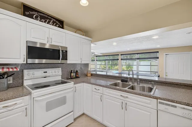 a bedroom with a bed and a table