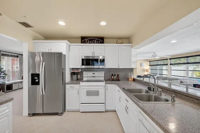 a room with lots of wooden furniture a dining table and chairs