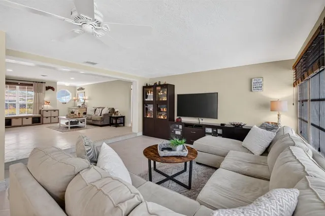 a bathroom with a granite countertop toilet sink and mirror