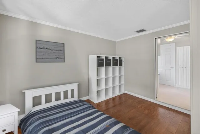 a view of a hallway with wooden shelves