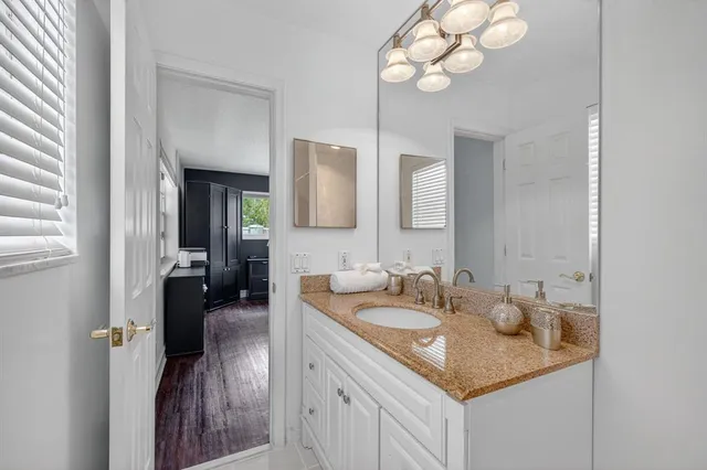 a view of living room with furniture and wooden floor