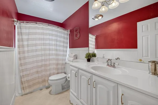 a view of a patio with table and chairs potted plants with wooden floor