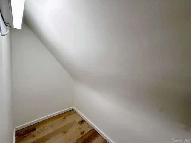 a utility room with multiple dryer and washer