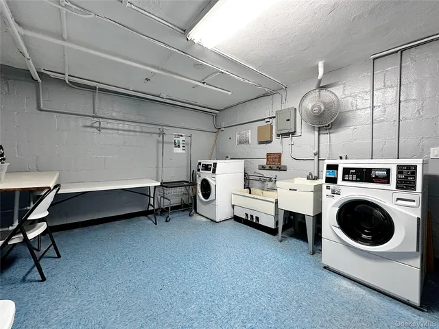 a front view of a residential apartment building with a yard