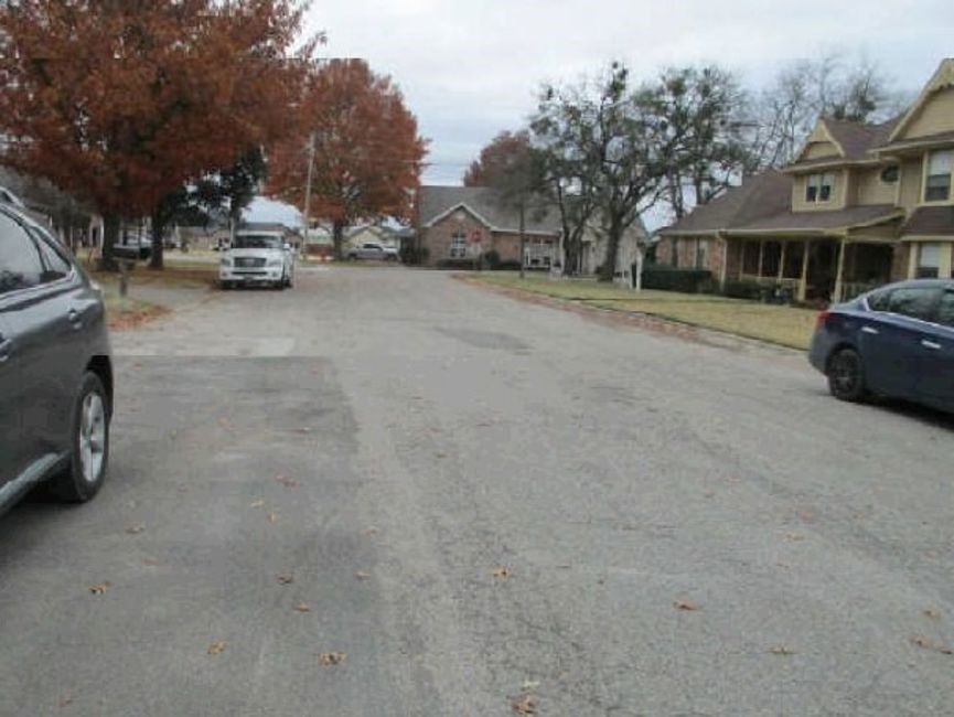 517 South Kirby Street Pilot Point, TX 76258 - Photo 6 of 6 a view of a street with cars