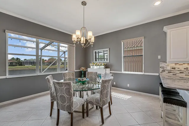 a view of a dining room with furniture window and outside view