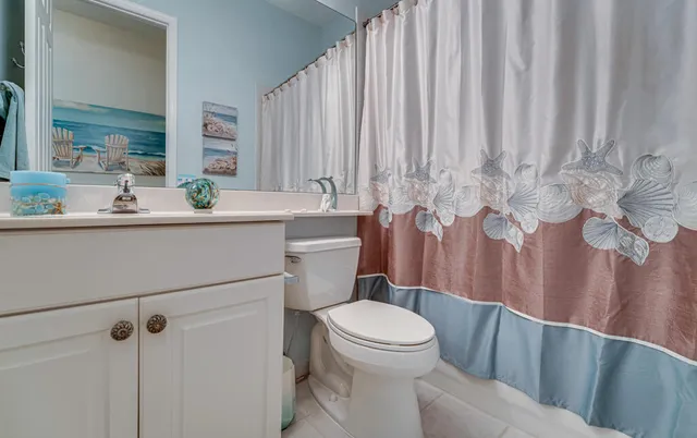 a view of a storage and utility room with closet fan