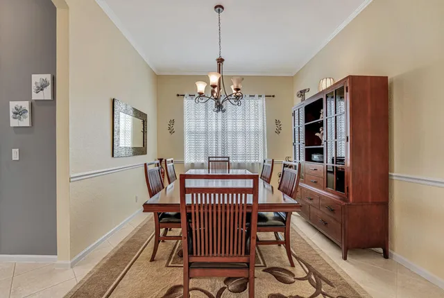 a view of a dining room with furniture and window