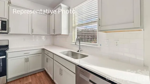 a kitchen with a sink and cabinets