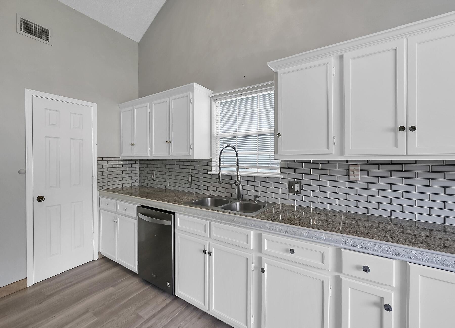 129 Wright Circle Niceville, FL 32578 - Photo 1 of 44 a kitchen with appliances a sink and cabinets