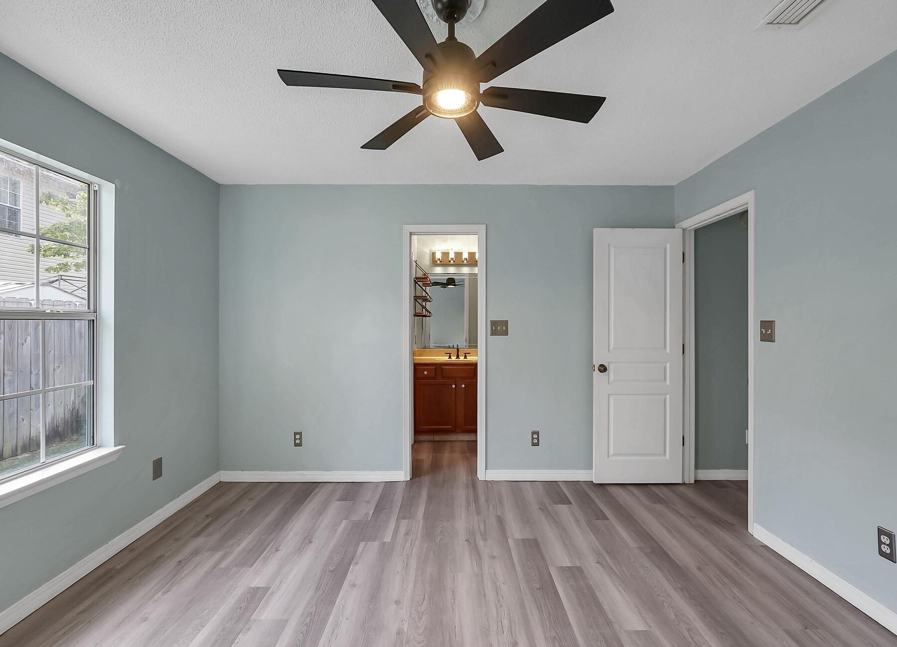129 Wright Circle Niceville, FL 32578 - Photo 27 of 44 wooden floor in an empty room with a window