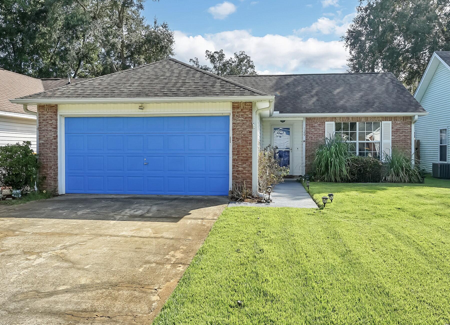 129 Wright Circle Niceville, FL 32578 - Photo 32 of 44 a view of a house with backyard and garden