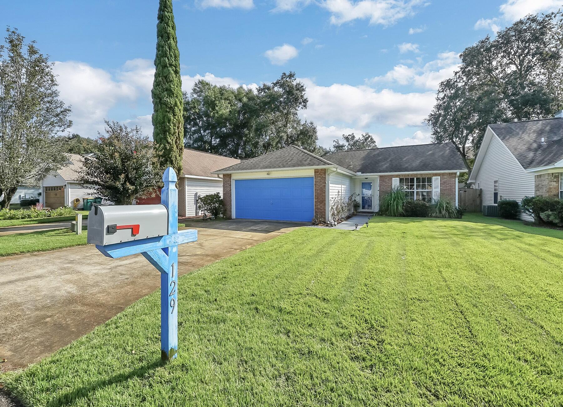 129 Wright Circle Niceville, FL 32578 - Photo 34 of 44 a house with sign broad in front of it