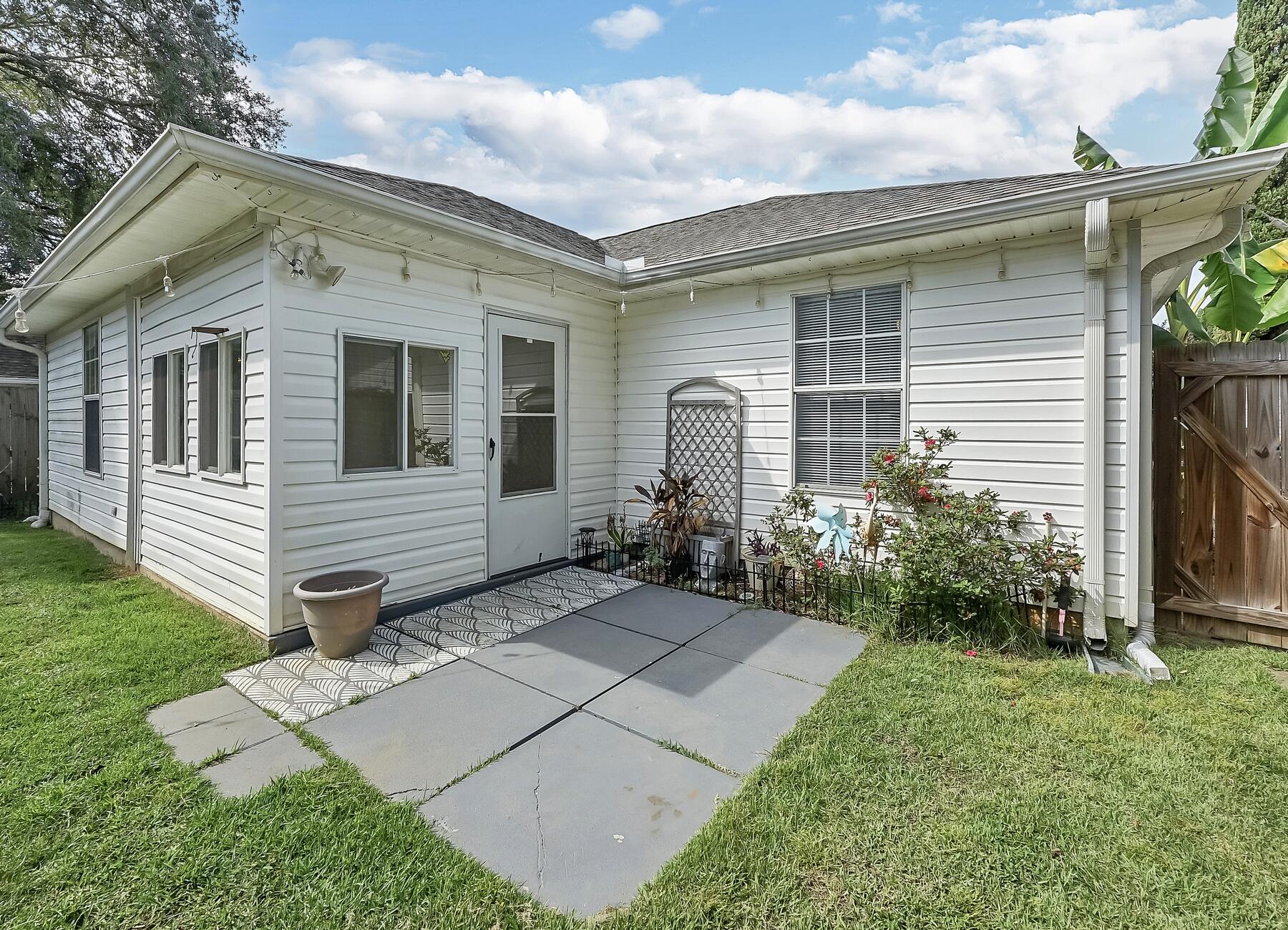 129 Wright Circle Niceville, FL 32578 - Photo 43 of 44 a view of a house with a yard and plants