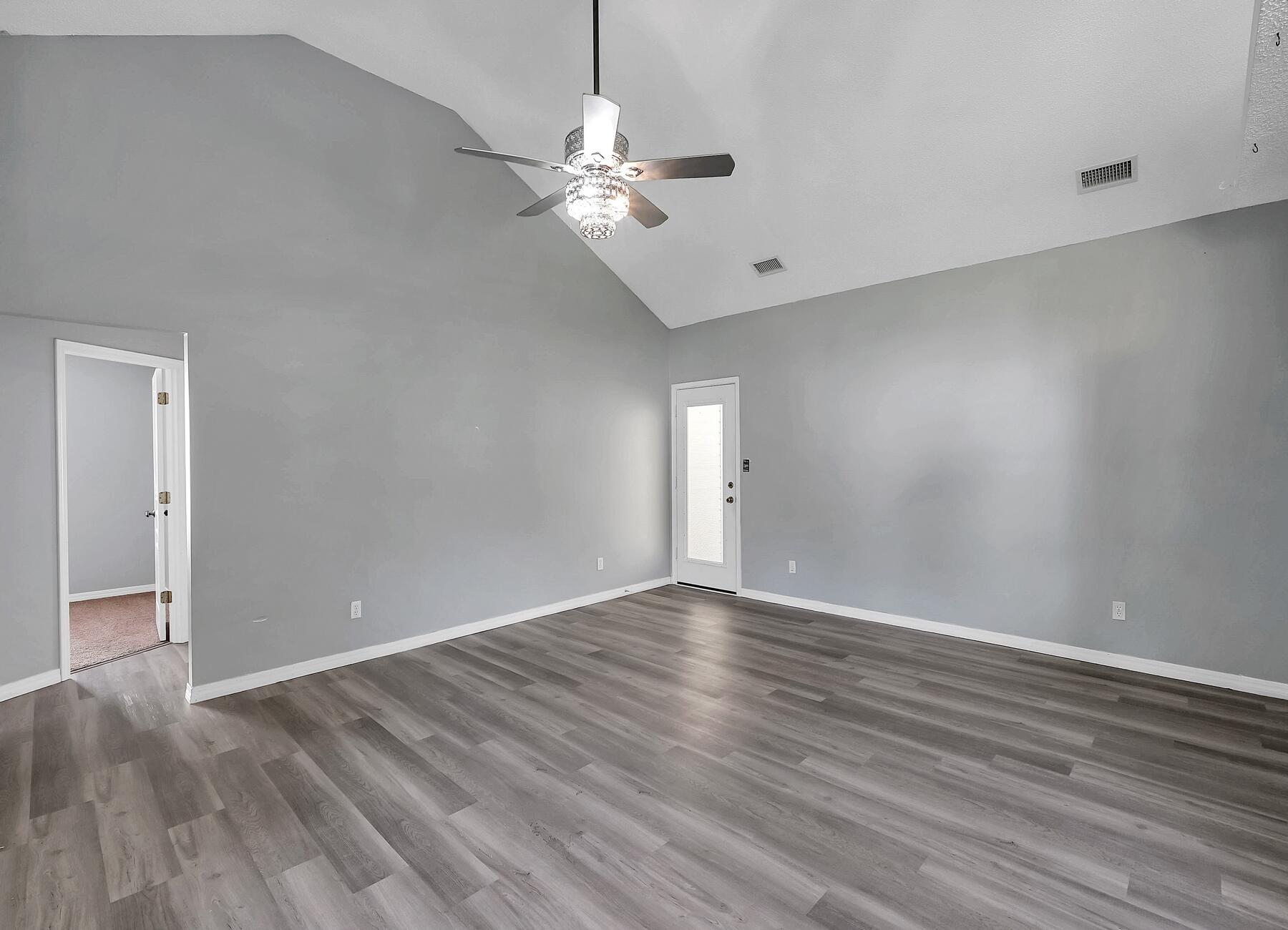 129 Wright Circle Niceville, FL 32578 - Photo 5 of 44 a view of an empty room with wooden floor