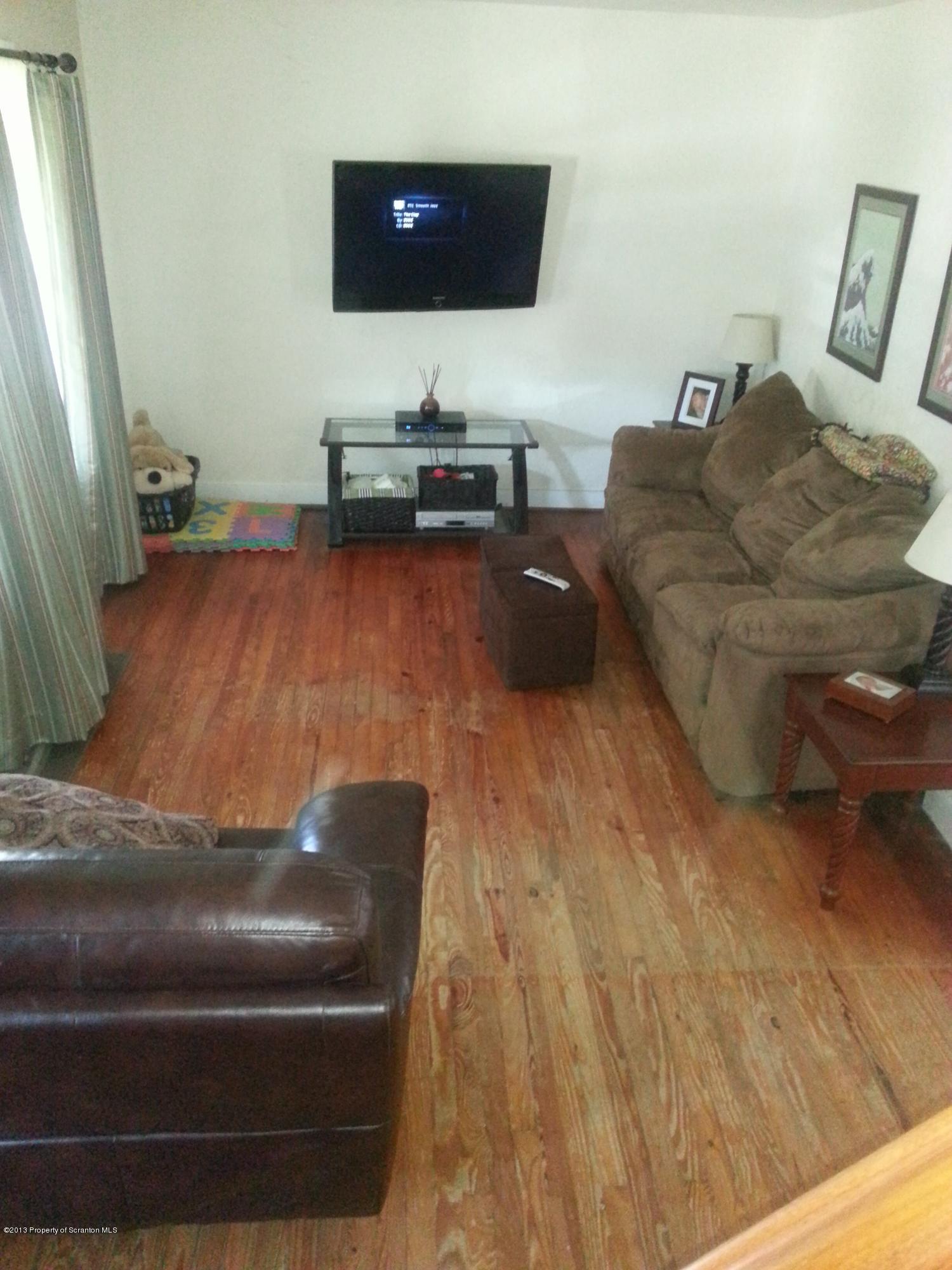 621 Electric Street Scranton, PA 18509 - Photo 11 of 29 a living room with furniture and a flat screen tv