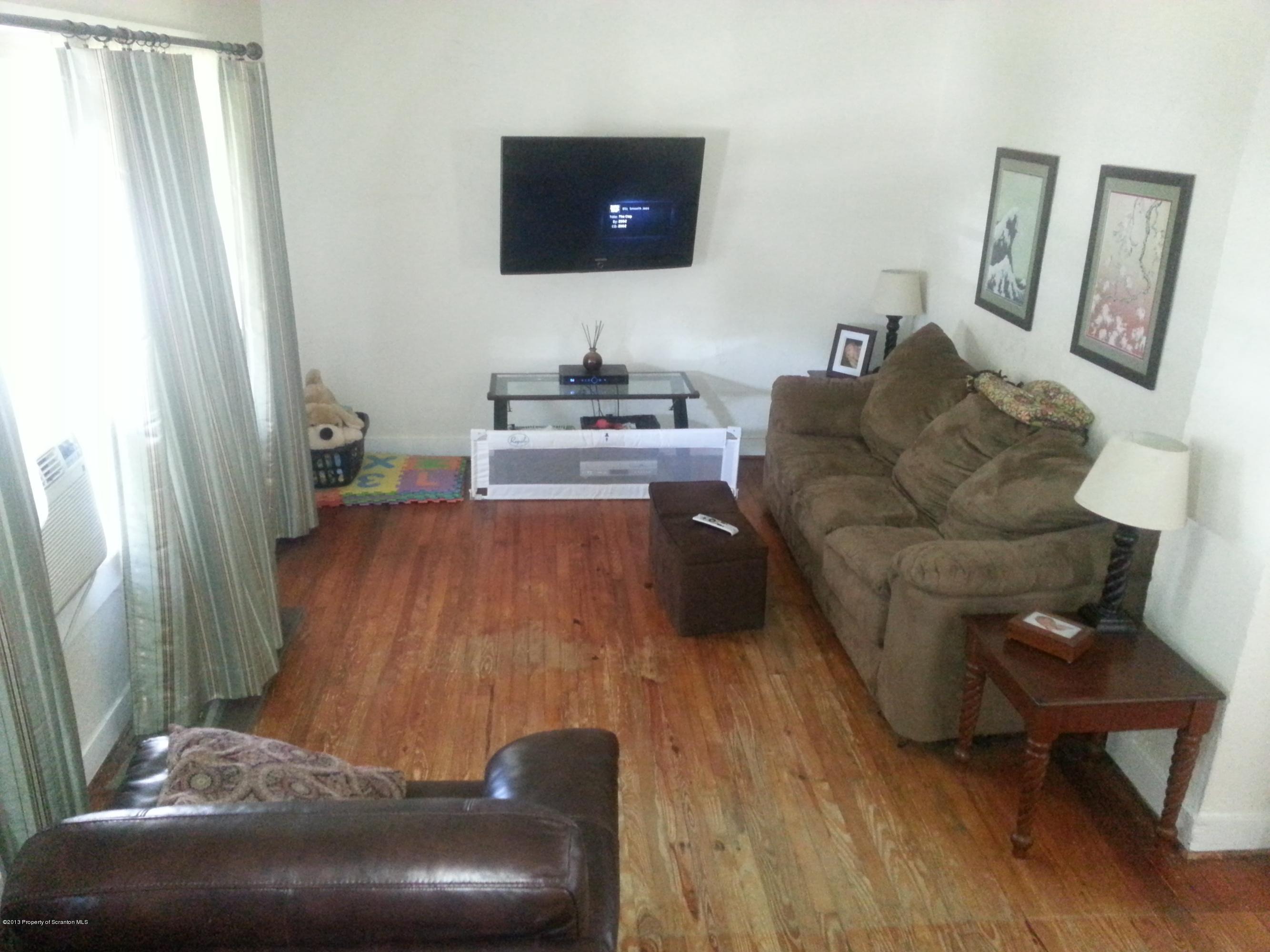 621 Electric Street Scranton, PA 18509 - Photo 12 of 29 a living room with furniture and a flat screen tv
