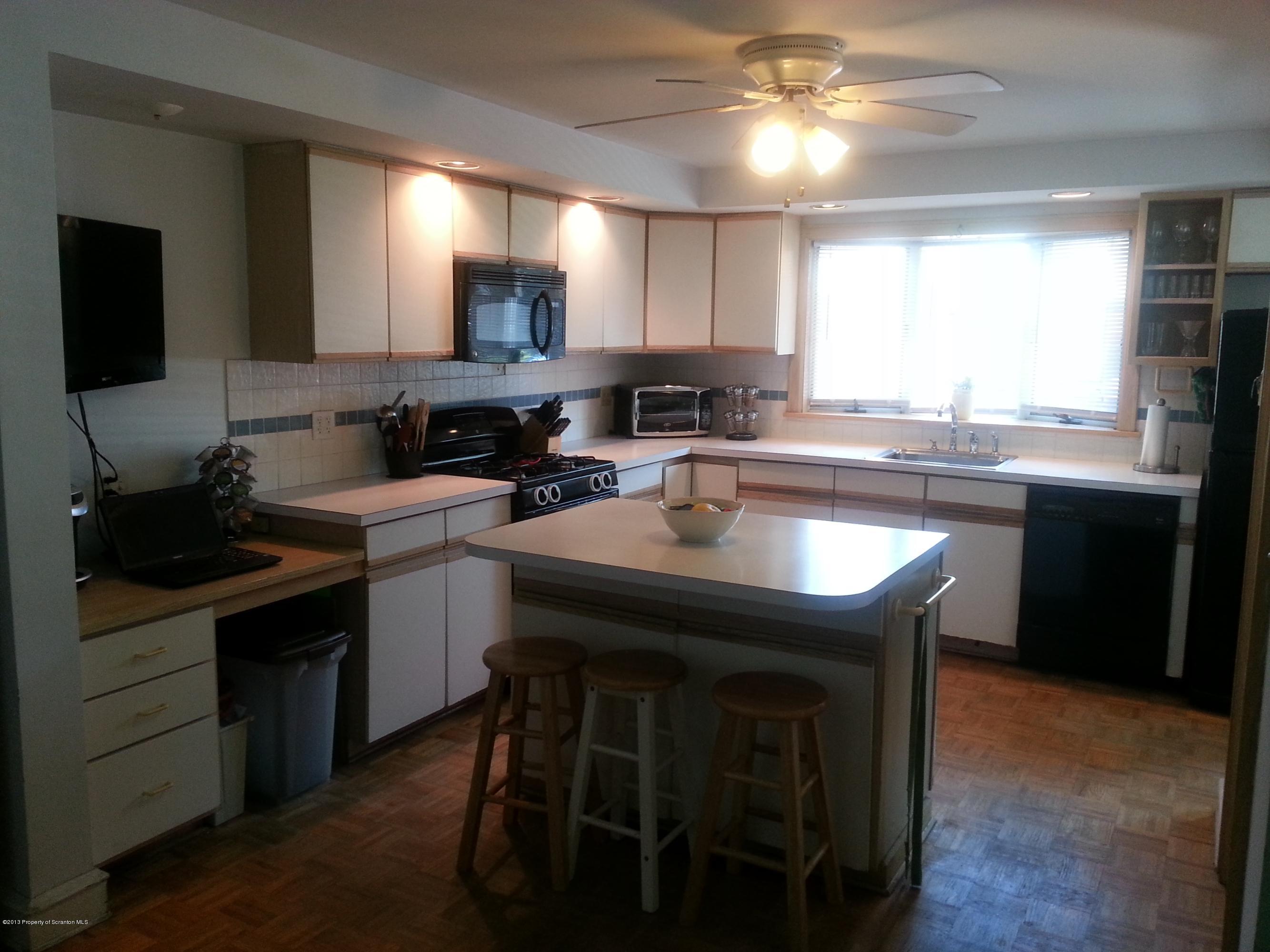 621 Electric Street Scranton, PA 18509 - Photo 14 of 29 a kitchen with a sink cabinets and wooden floor